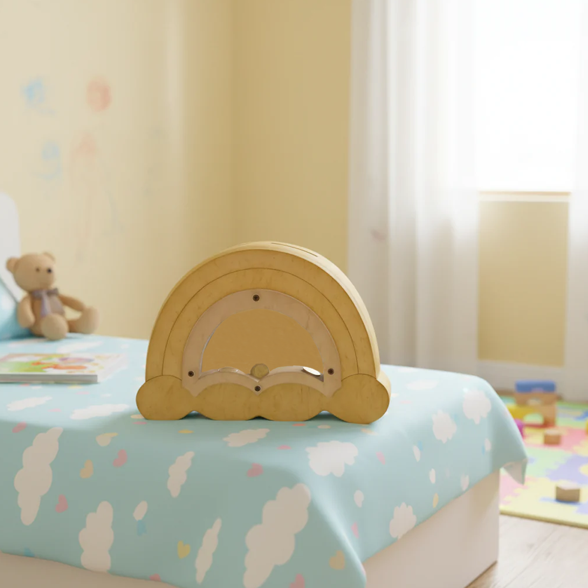 DIY MDF Rainbow shaped money bank on a child's bed with a teddy bear and colorful decor in the background.