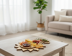 MDF paisley coaster holding cheese, grapes, crackers, and dip on light wooden coffee table