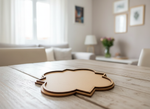 MDF quatrefoil-shaped coaster placed on rustic wooden dining table in cozy living room