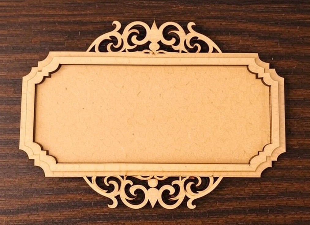 Ornate rectangular MDF platter with scroll-cut design on dark wooden background.