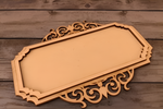 Elegant MDF platter with intricate border placed on rustic wooden table.