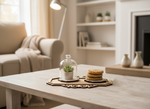MDF tray with succulent décor and cookies placed on rustic coffee table in cozy living room