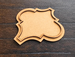 Small Moroccan MDF platter with layered edge on wooden surface.