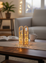 MDF candle holder lit with warm glow, book and coffee cup in background