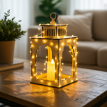 Decorative lantern with string lights on a wooden table in a living room setting.