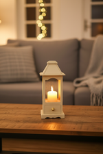 Cozy living room with a glowing candle lantern on wooden table