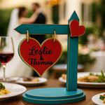 Blue painted MDF heart sign board with couple's names, used for wedding table decor