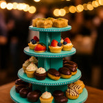 Three-tier MDF cupcake and dessert stand decorated with rhinestones, displaying assorted mini pastries, chocolate eclairs, and fruit tarts.
