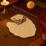 MDF lotus leaf incense holder base with layered floral design placed on red festive cloth.