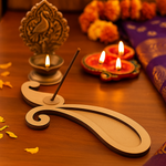 Minimal paisley incense holder with incense stick releasing smoke on wooden table.