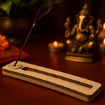 MDF incense stand in temple setting, incense stick burning with visible smoke.