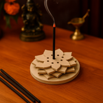 MDF layered flower-shaped incense holder with lit incense stick