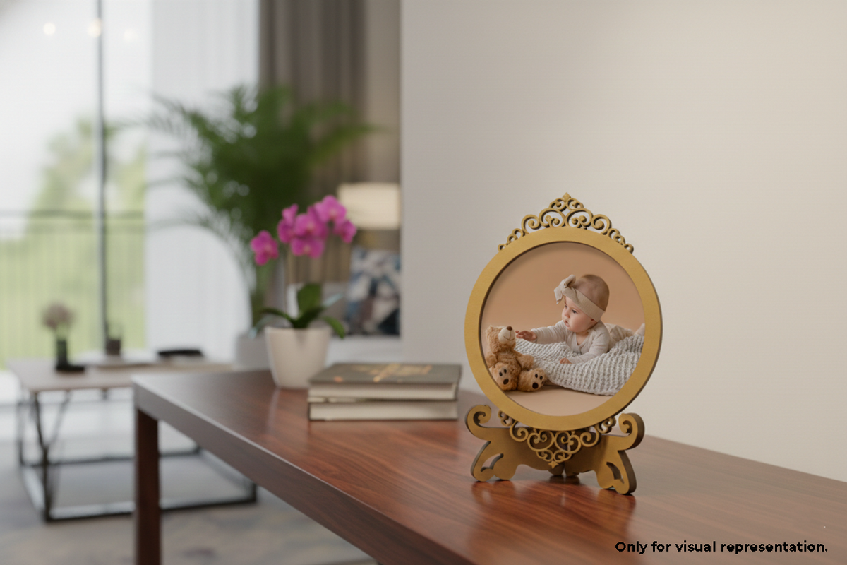 Decorative photo frame with a child and teddy bear on a wooden surface in a room.