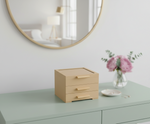 MDF DIY Jewellery Box on a dresser with a mirror and flowers in the background