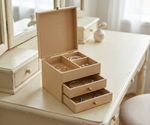 MDF DIY  jeweIlery box with jewelry on a light wooden surface