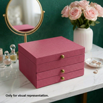 Pink MDF DIY  jeweIlery box on a marble surface with a mirror and flowers in the background.