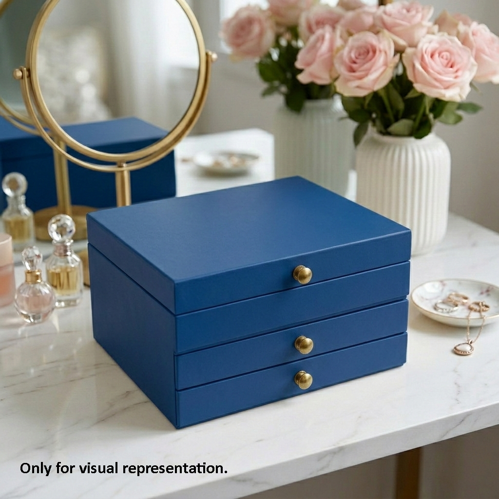 Blue MDF DIY  jeweIlery box with gold knobs on a marble surface, surrounded by decorative items.
