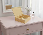 MDF DIY Jewellery Box on a pink dresser with a mirror and flowers in the background