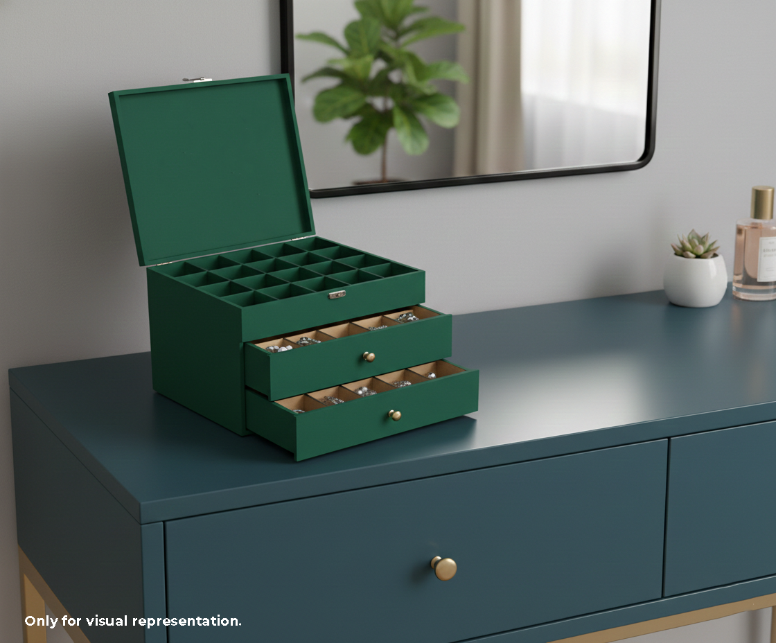Green MDF DIY Jewellery Box on a teal dresser with a mirror and plants in the background