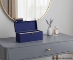 Blue MDF DIY Jewellery Box on a gray dresser with a mirror and decorative items in the background