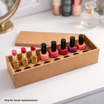 Set of lipsticks and nail polishes in a MDF DIY box holder on a white surface.