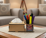 A  MDF DIY tissue box holder with a built-in cup holding colorful pens and markers, placed on a woven placemat on a wooden table in a living room setting.