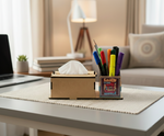 A  MDF DIY tissue box cover and a matching pen holder with colorful pens and markers sit on a woven placemat on a white table, with a softly blurred home office background.