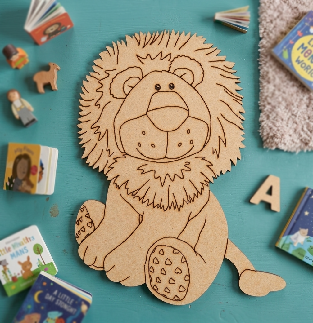 MDF DIY  lion cutout on a teal surface with children's books and toys around