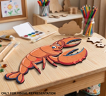 MDF DIY  lobster puzzle on a wooden table with art supplies in the background