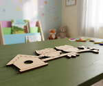 MDF DIY animal shapes on a table in a child's room with books and toys in the background