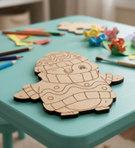 MDF DIY  cutout on a teal table with art supplies