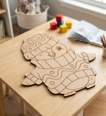 MDF DIY cutout of a snowman on a wooden table with colorful blocks in the background.