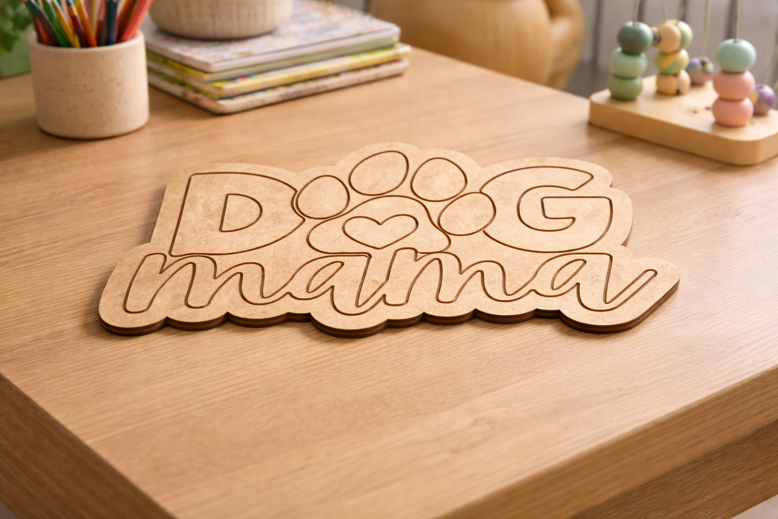 MDF DIY sign with 'Dog Mama' on a wooden surface