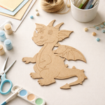 MDF DIY dragon cutout on a table with art supplies