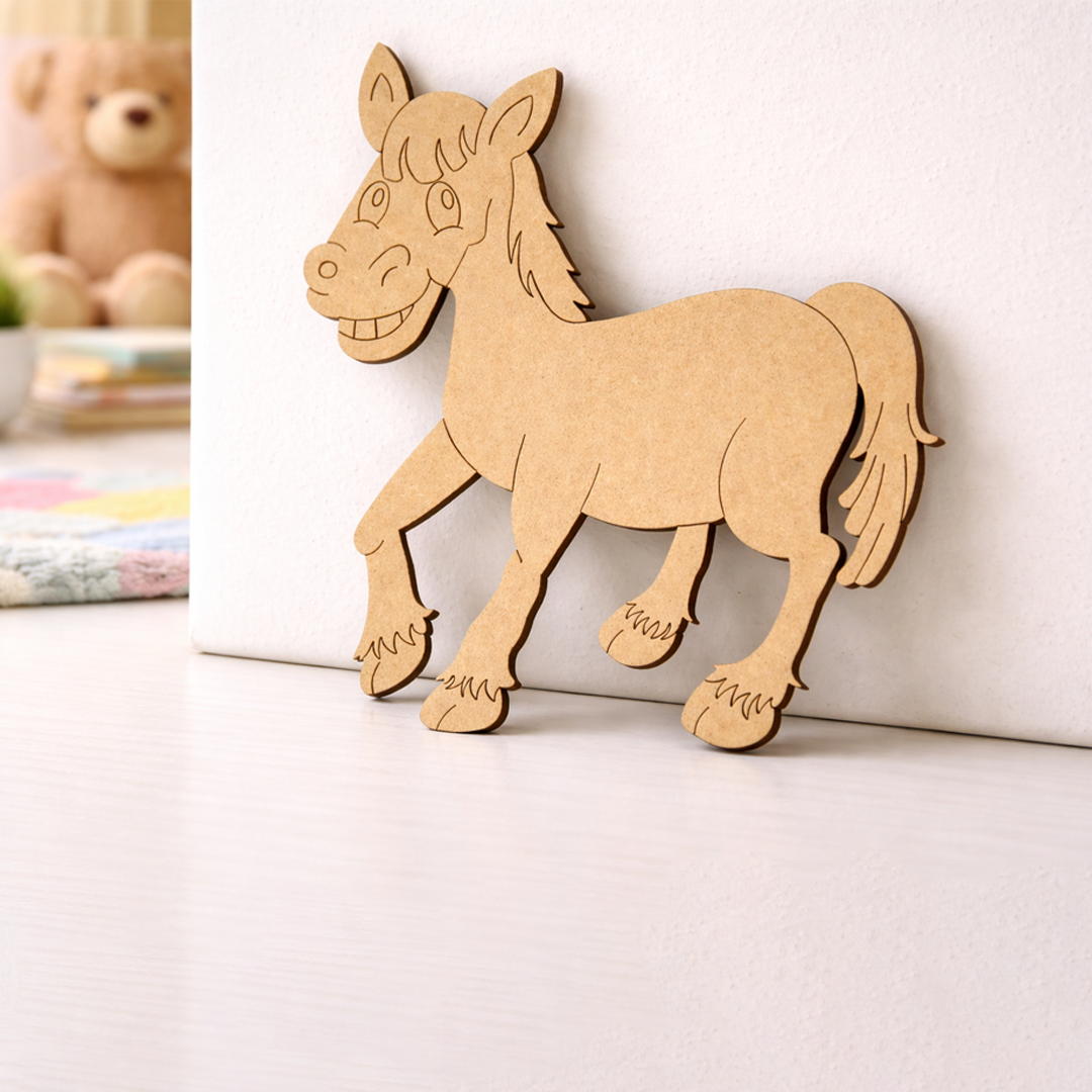 MDF DIY horse cutout on a white surface with a teddy bear in the background