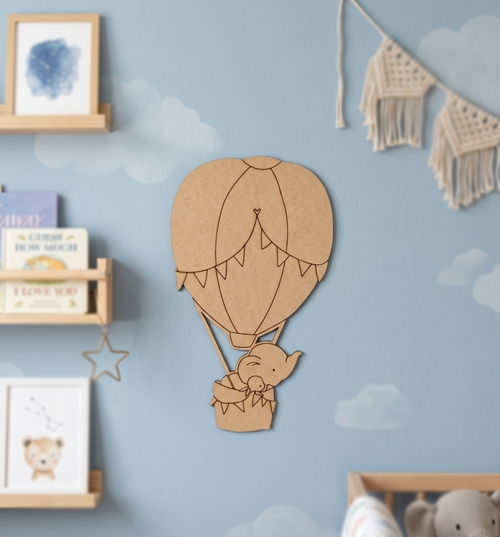 MDF DIY hot air balloon wall decoration on a blue wall with cloud patterns.