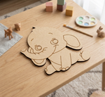 MDF DIY elephant cutout on a wooden table with art supplies