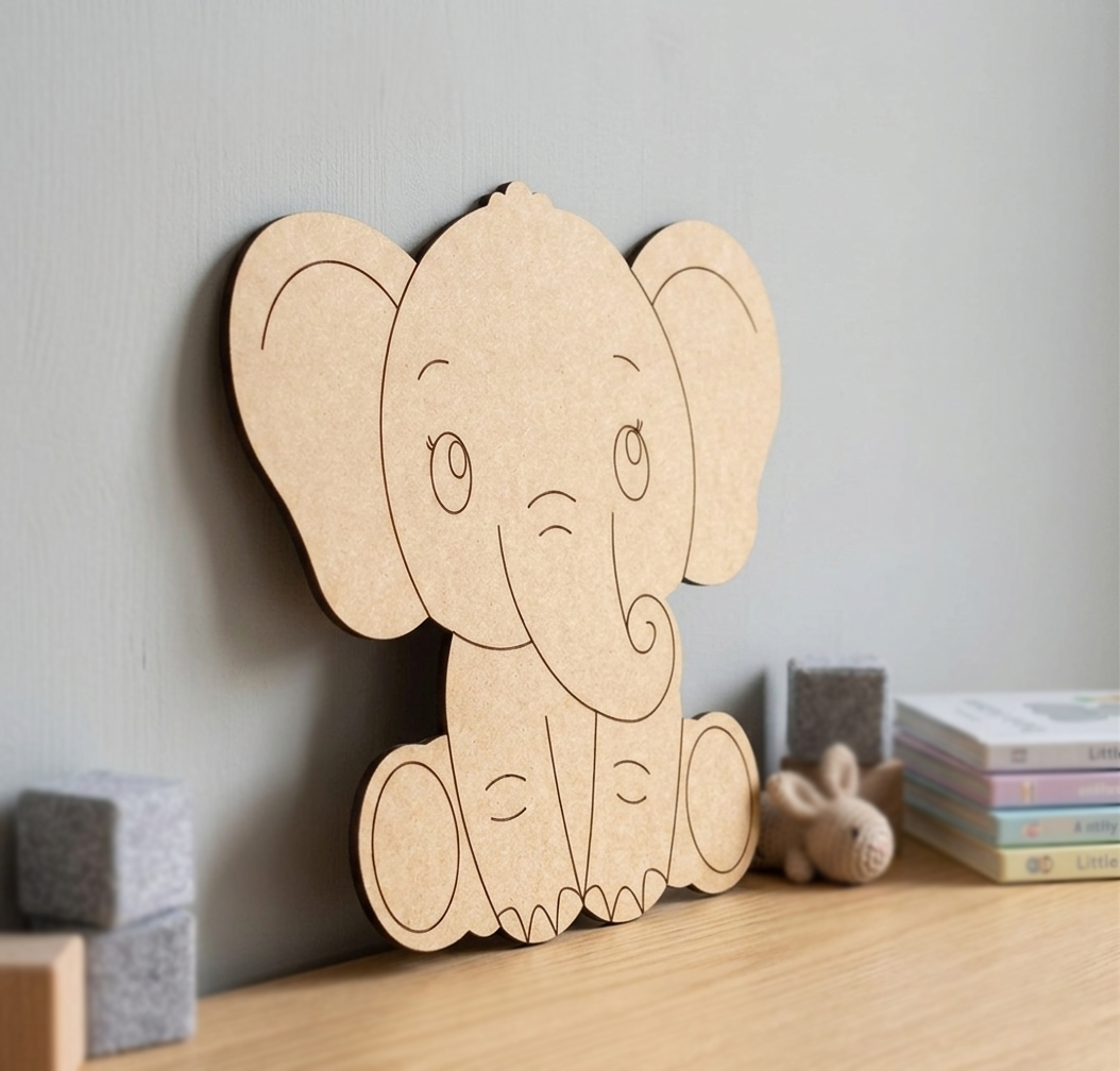 MDF DIY elephant toy on a shelf against a light gray wall