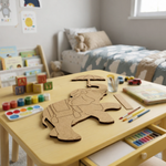 Children's playroom with a wooden table featuring MDF DIY cutouts and art supplies.