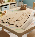 MDF DIY cutout of a gingerbread man on a child's play table with toys and stationery.