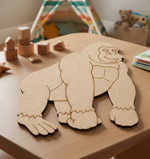 MDF DIY gorilla puzzle on a table with toys in the background