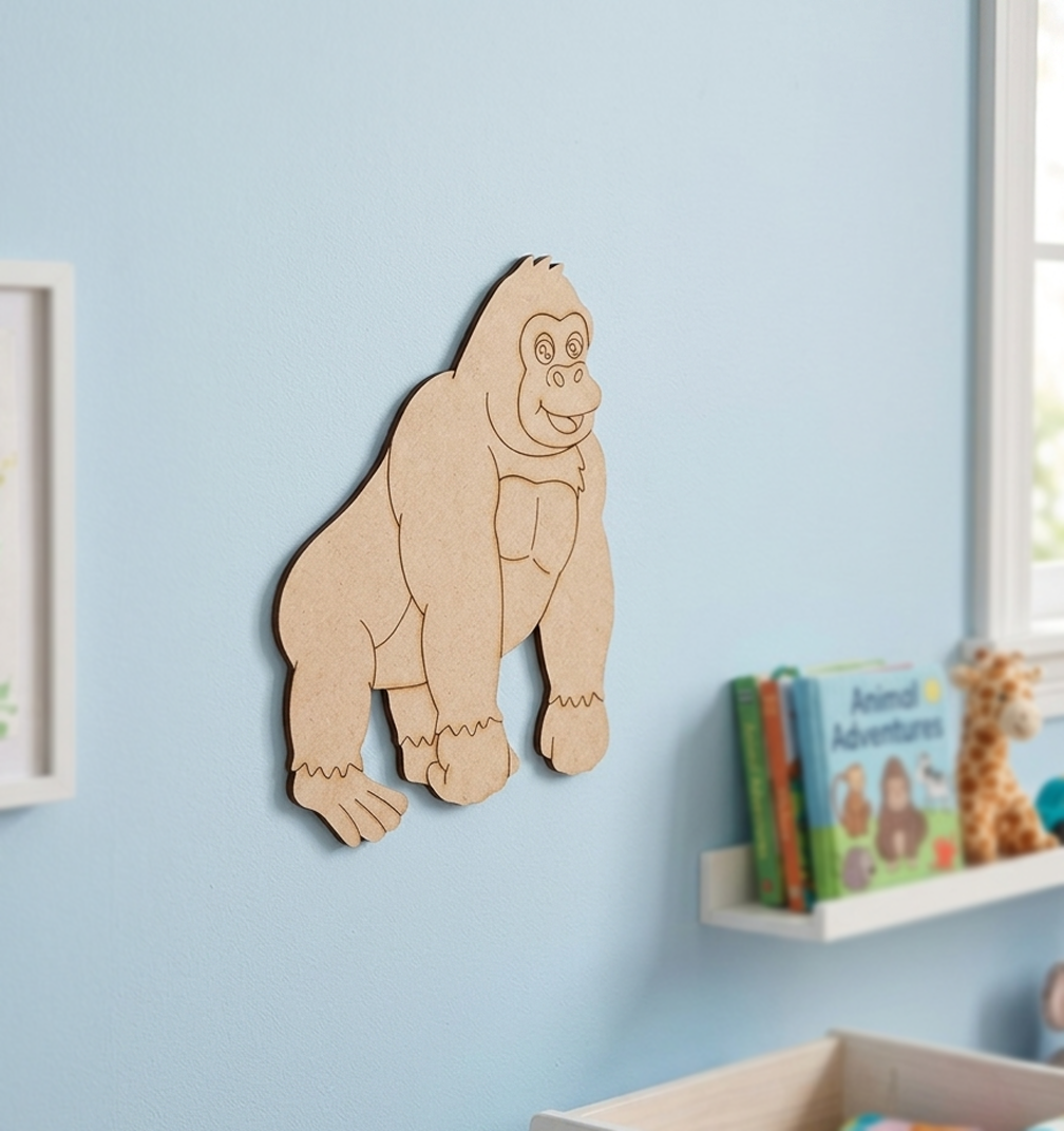 MDF DIY gorilla wall decoration on a light blue wall with children's books below.