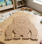 DIY MDF Gorilla cutout on a brown table.