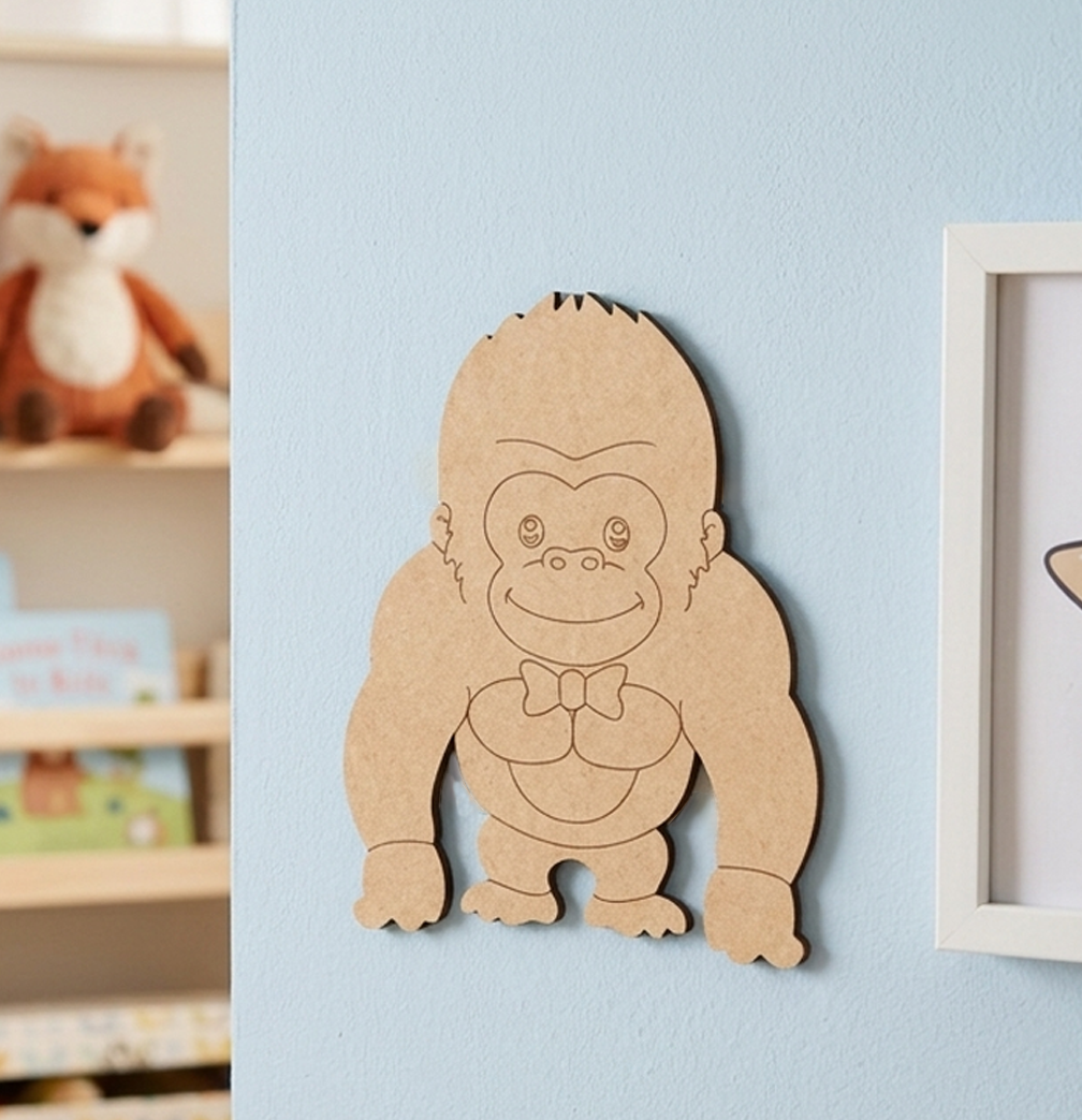 DIY MDF Gorilla cutout on  blue wall.