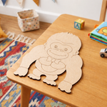 DIY MDF Gorilla cutout on a brown table.
