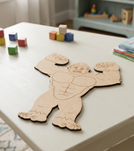 MDF DIY cutout with a gorilla design on a table surrounded by colorful blocks and books.