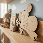MDF DIY  koala decoration on a shelf with books and toys in a child's room.