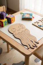 Children's play area with a MDF DIY jellyfish toy on a table.