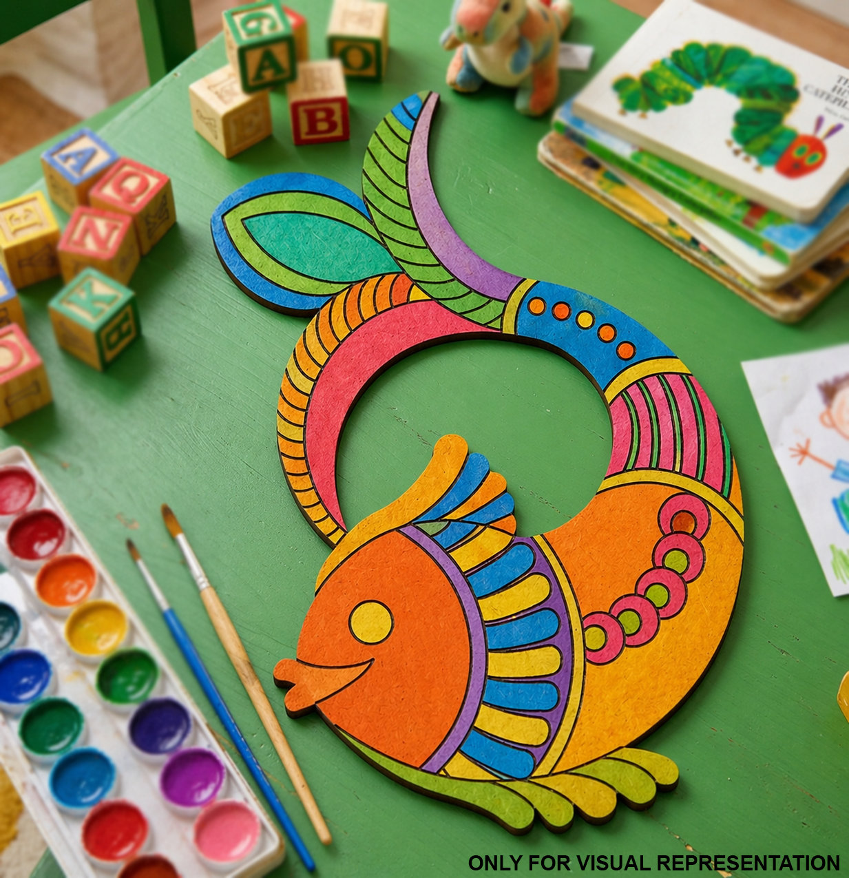 MDF DIY Colorful fish-shaped craft on a green table with art supplies