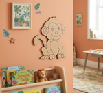 MDF DIY  monkey wall decoration in a child's room with books and toys.